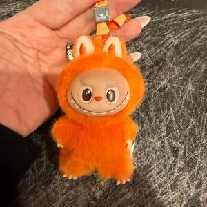 Labubu pinned for love: letter z. Orange Furry Character Keychain